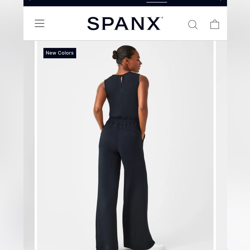 Air essentials jumpsuit, navy blue, new with tags!
